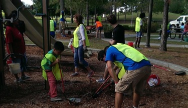 Volunteers cleaning a playground