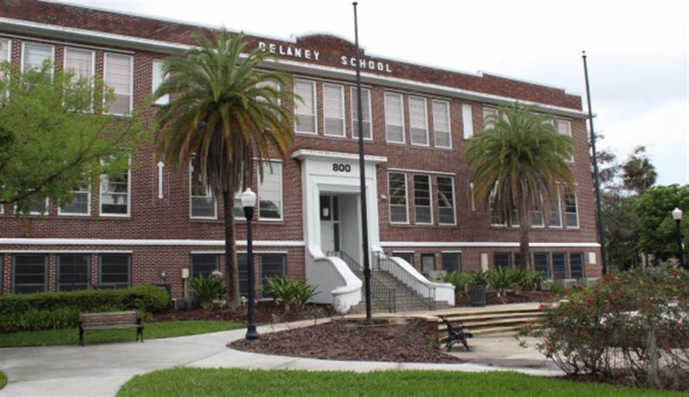 Exterior of the Beardall Neighborhood Center. It is a two story brick building, formerly the Delaney School.
