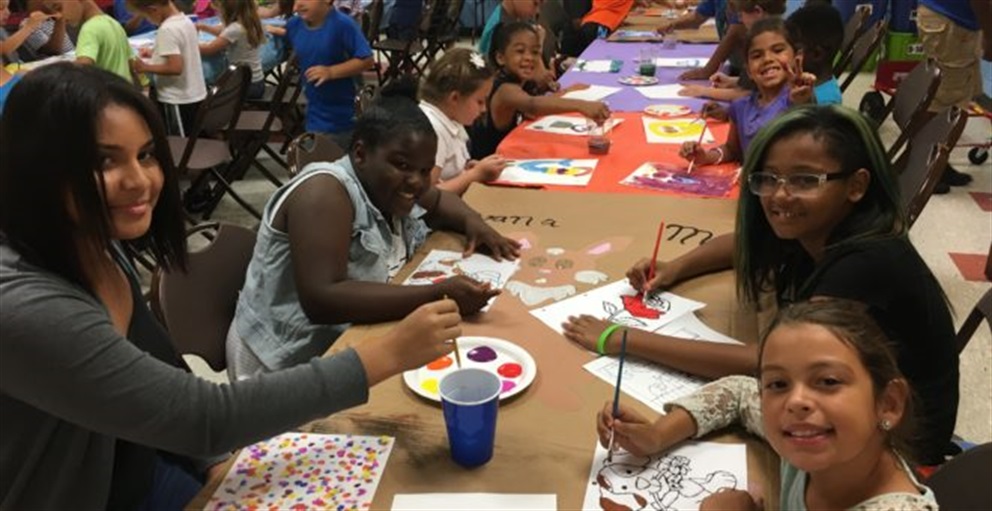 Children enjoying a painting activity.