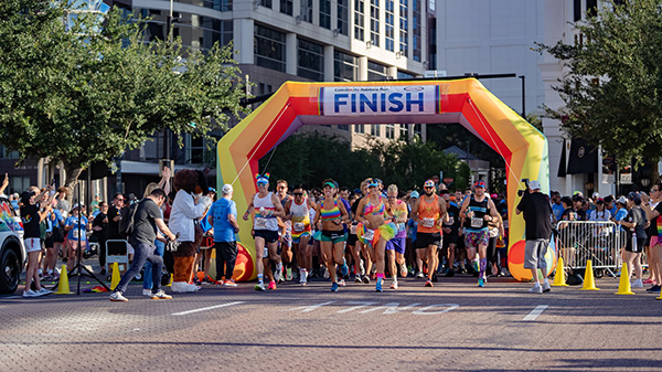 Runners approaching the finish line at the CommUNITY Rainbow Run