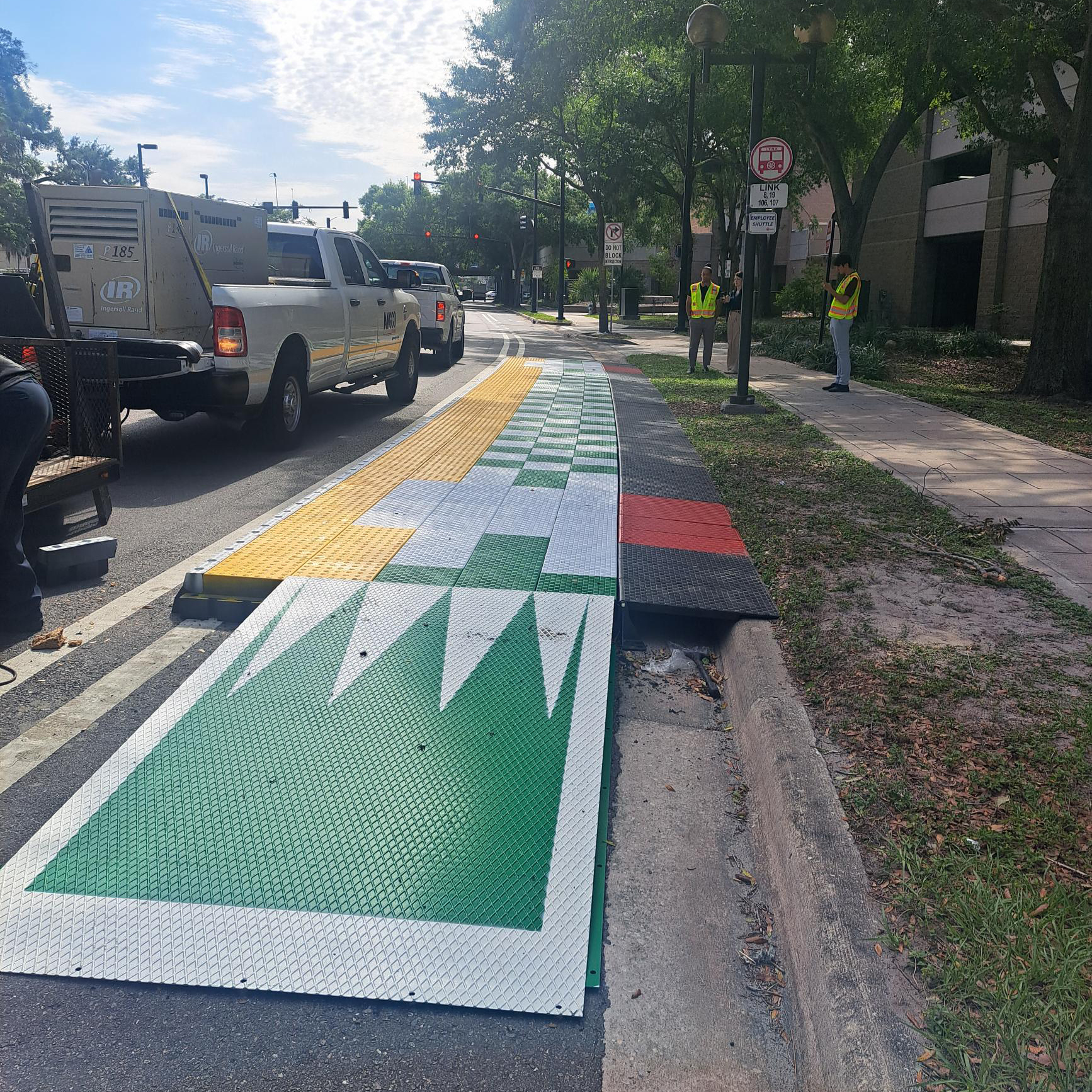 A photograph of a modular bus boarding platform.